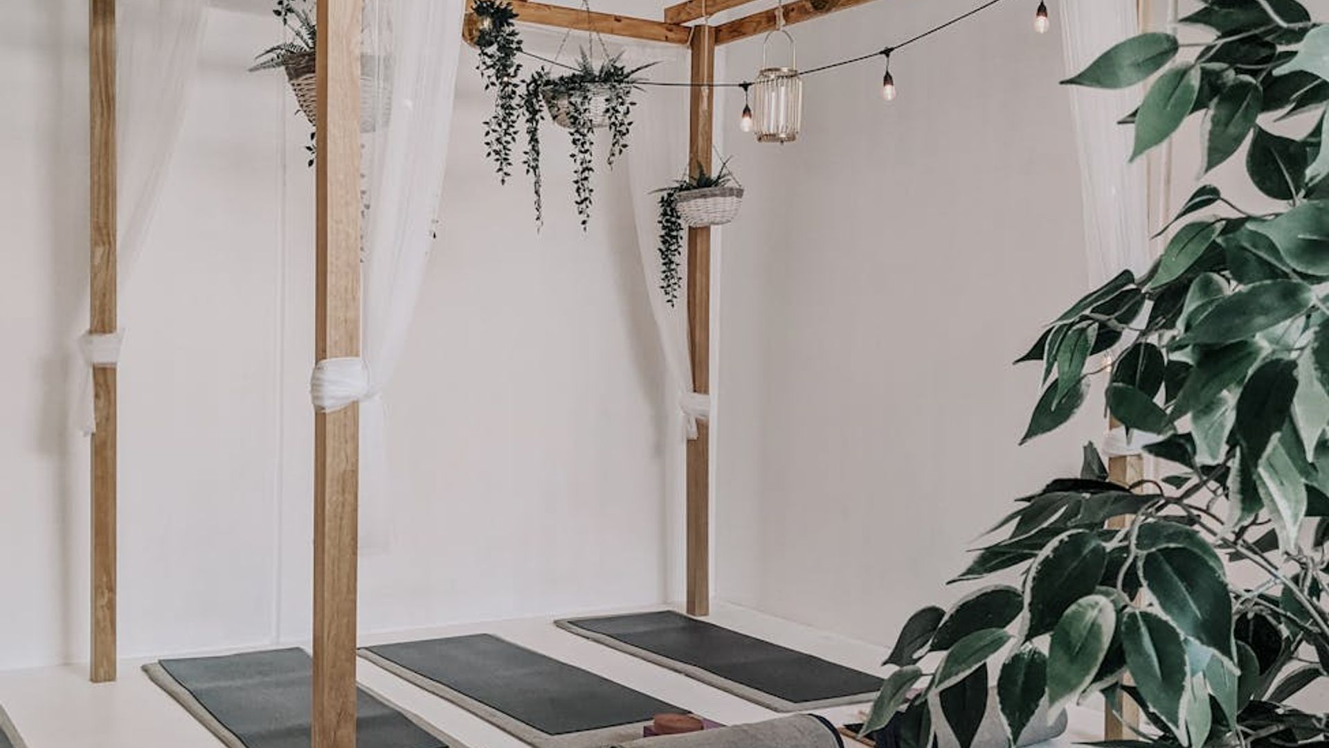 Minimalist yoga studio with soft blue neon lighting accents