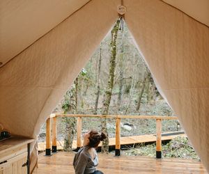 Silhouette of a person in a deep stretching pose